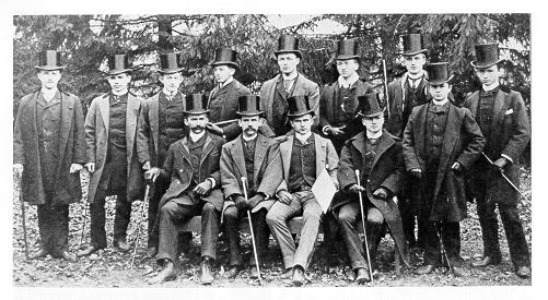 old black and white photograph of men in top hats
