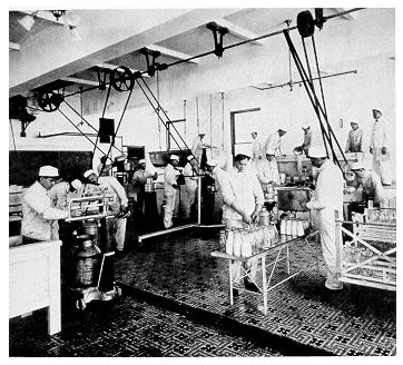old black and white photograph of students working in the creamery