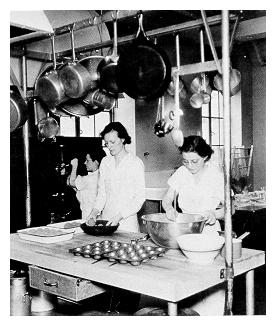 Students preparing a meal to be served in the cafeteria of the Home Economics Building