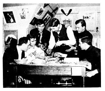 old black and white photograph of students in cramped room