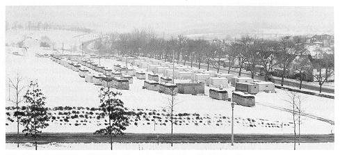 old black and white photograph of student housing in snowy field