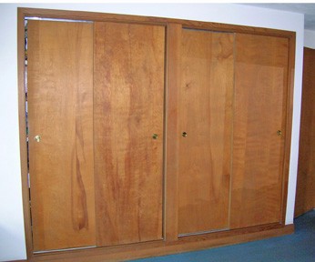 wooden sliding doors in the master bedroom