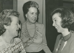 Carla Hills laughing with two other women