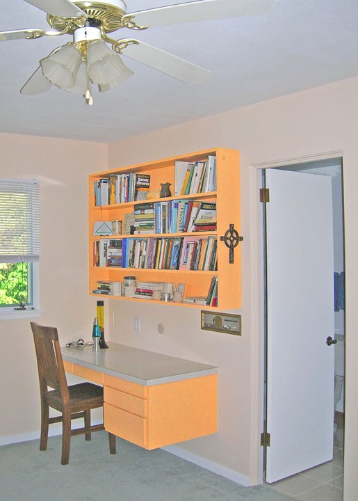 View of desk and shelves in one bedroom
