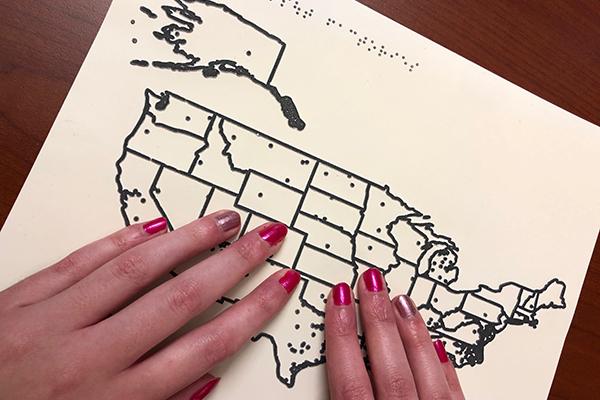 Blind student studies map using raised lines